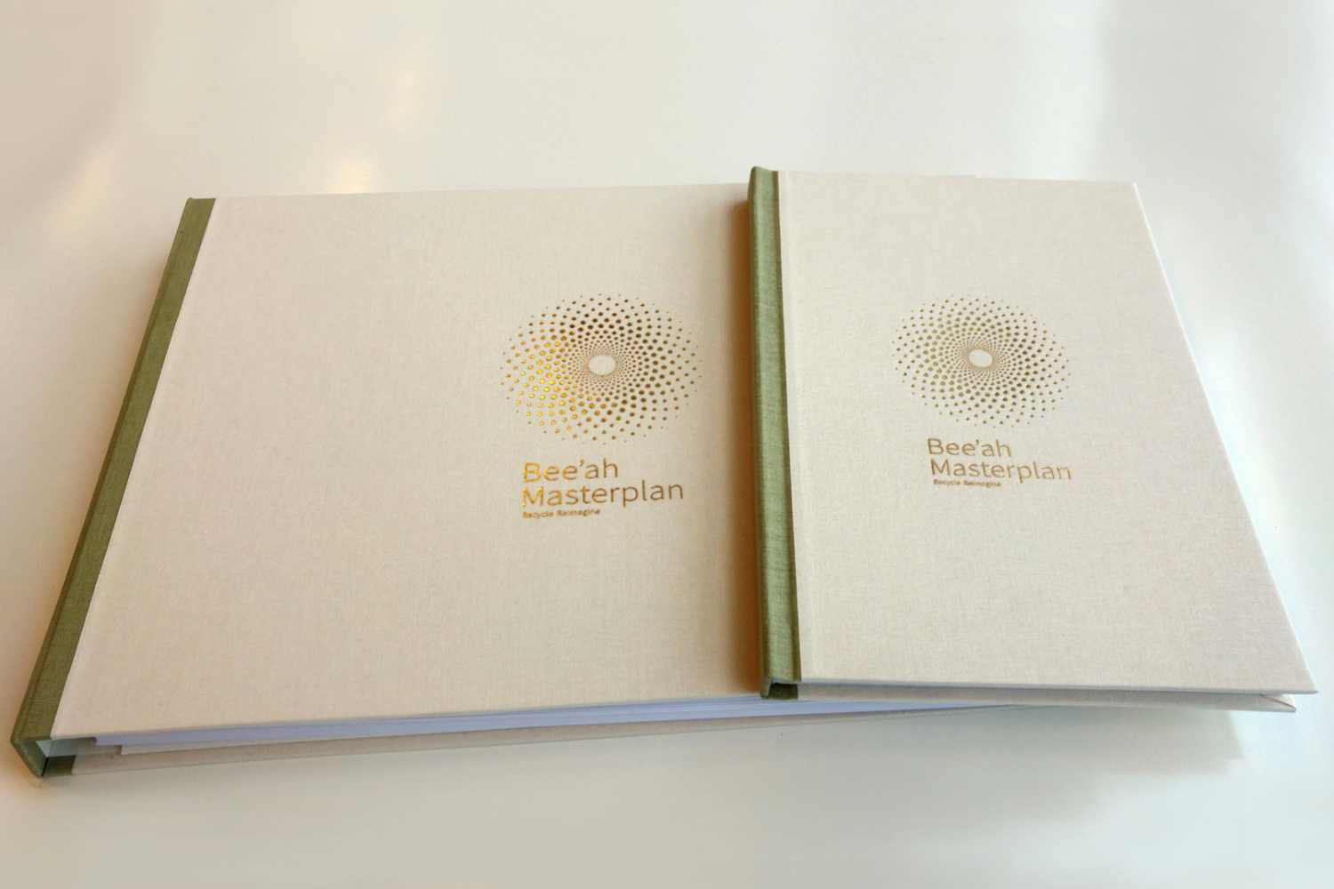 Bee'ah report covers with deboss and foil logo